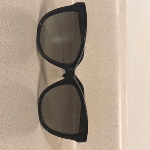 Woman’s Black Coach sunglasses